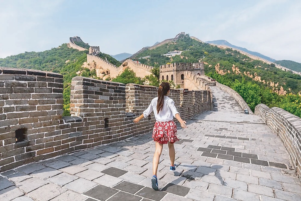 Traveller walking along the Great Wall of China