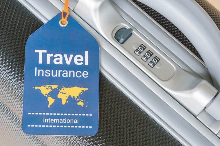 Travel insurance tag on luggage